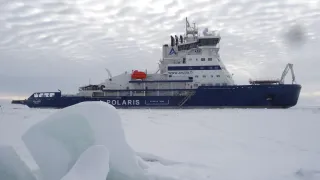Ship in arctic conditions going through icy waters
