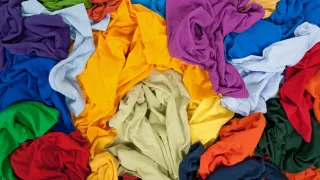 A photo of a pile of colourful clothes