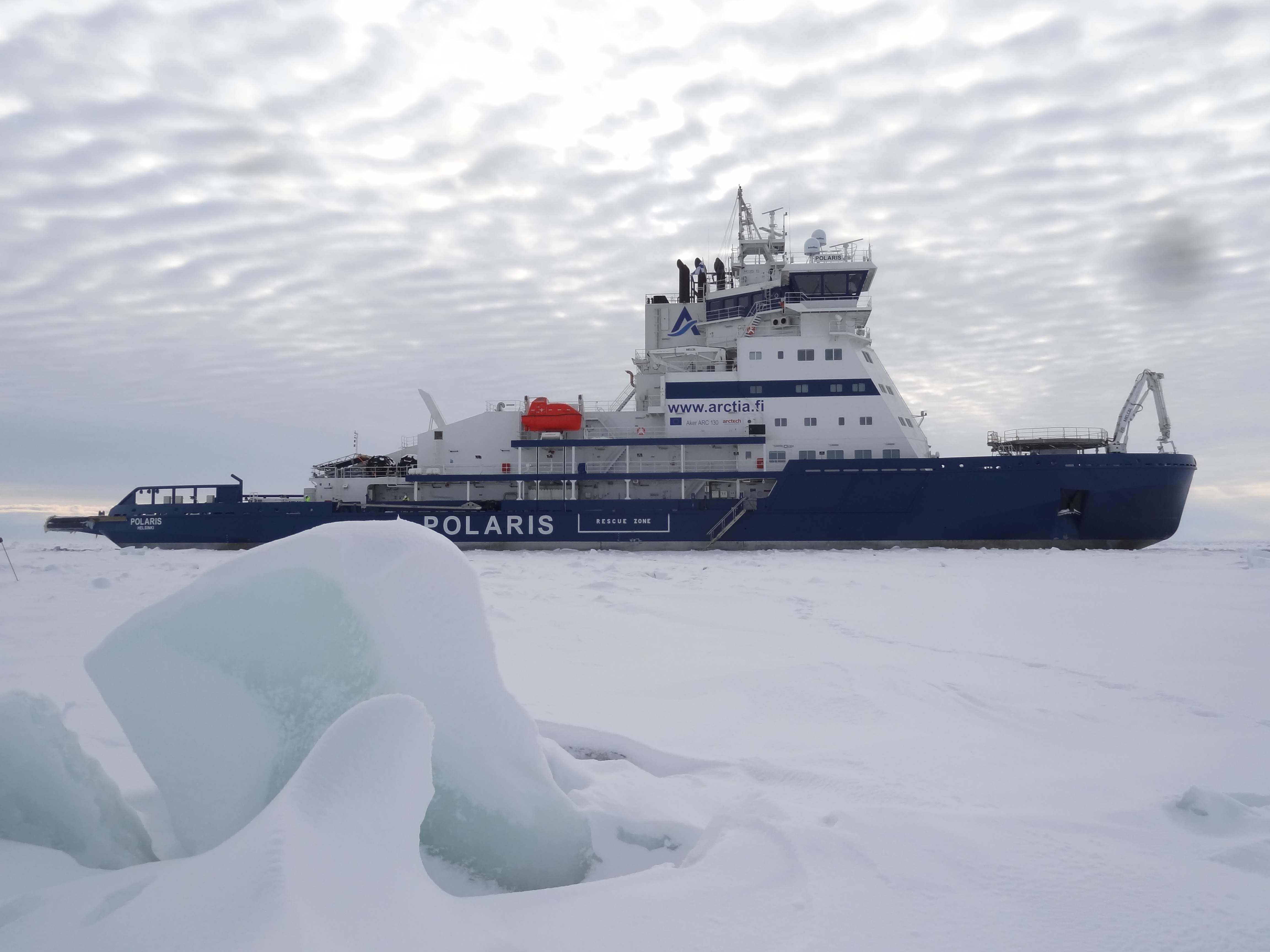 Ship in arctic conditions going through icy waters