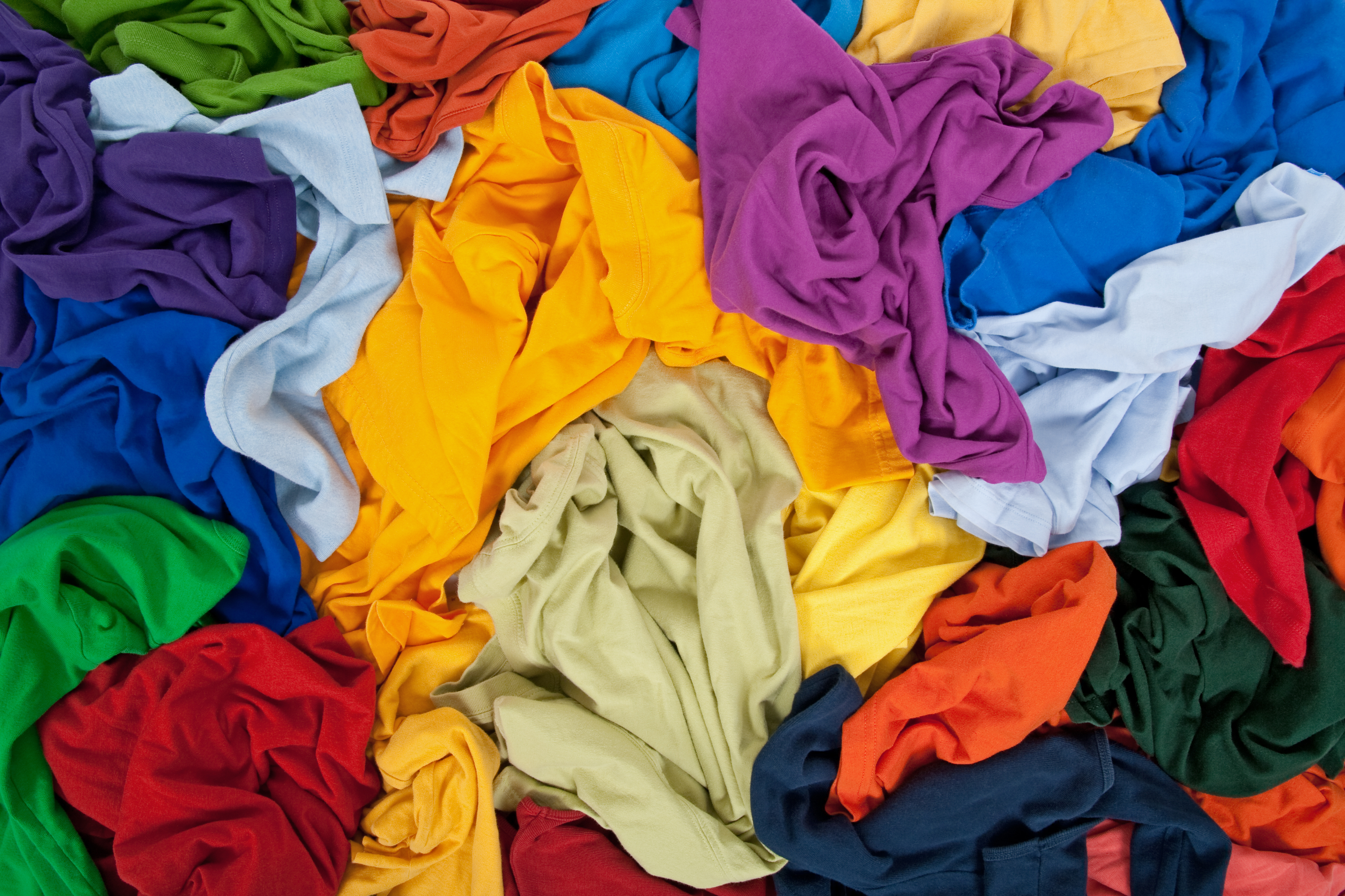 A photo of a pile of colourful clothes.