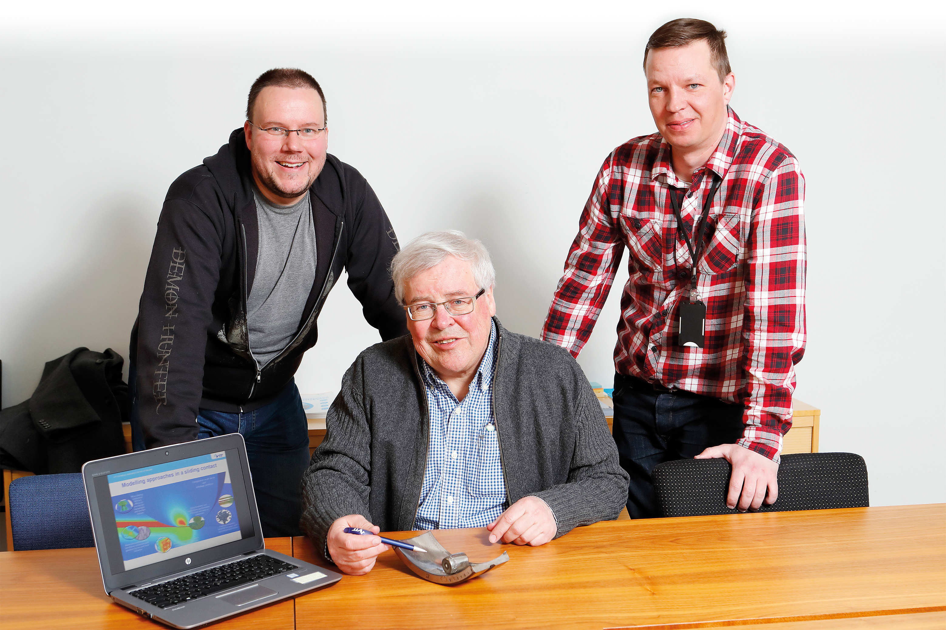 A photo of VTT's tribology experts Anssi Laukkanen, Kenneth Holmberg and Tomi Suhonen.