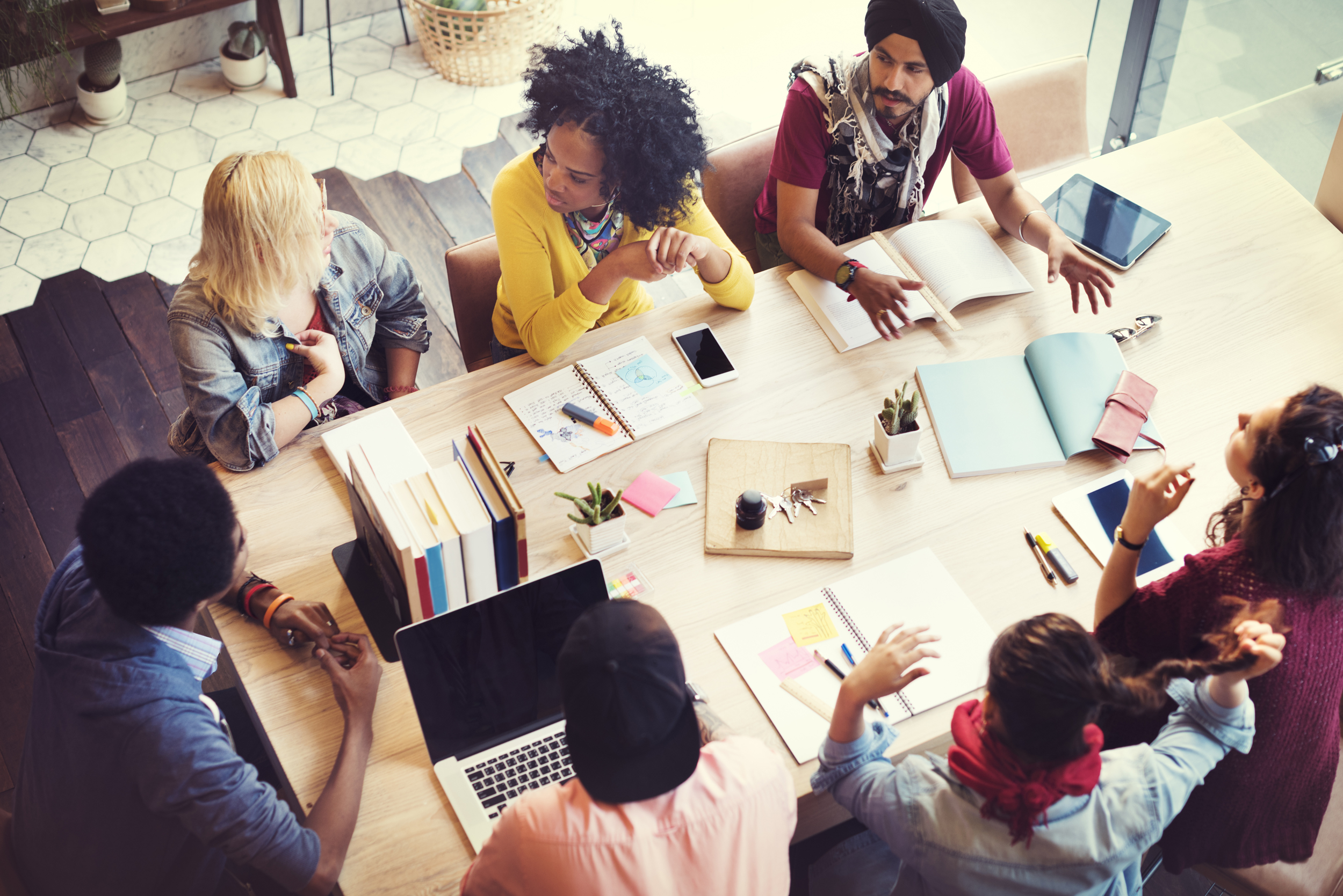 Photo of people around a meeting table