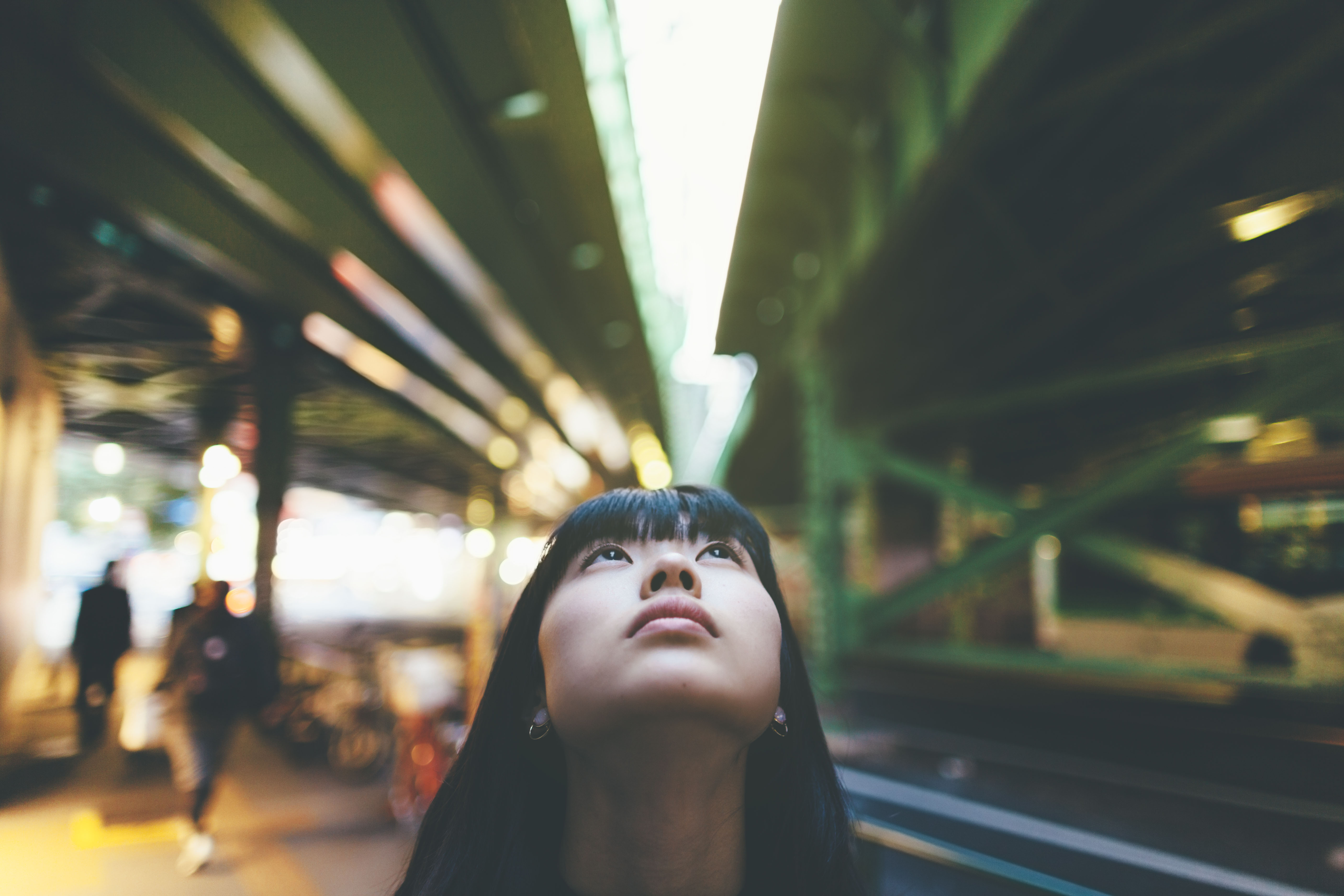Woman looking up in the city