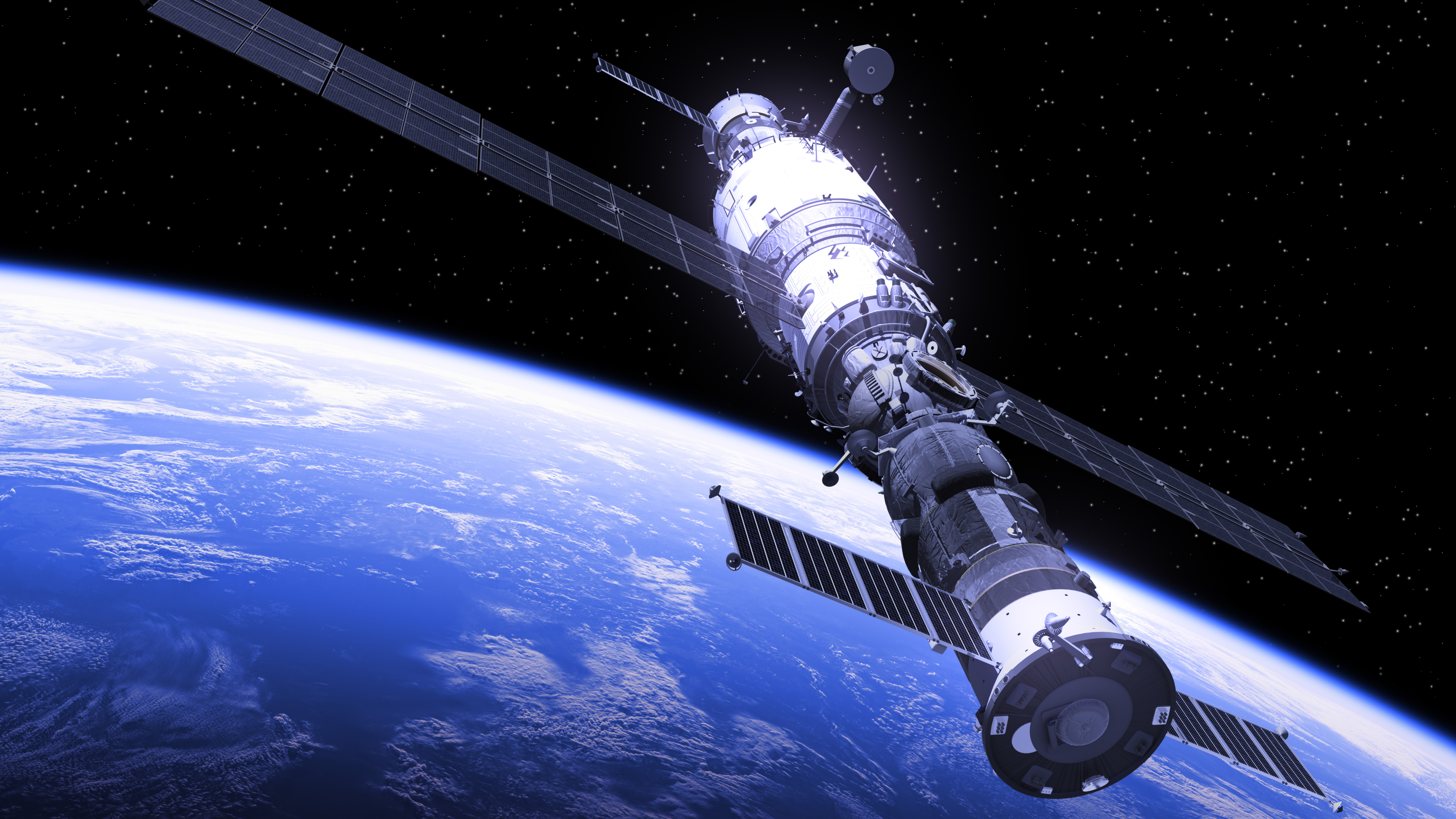 Image of satellite in space with Earth in the background