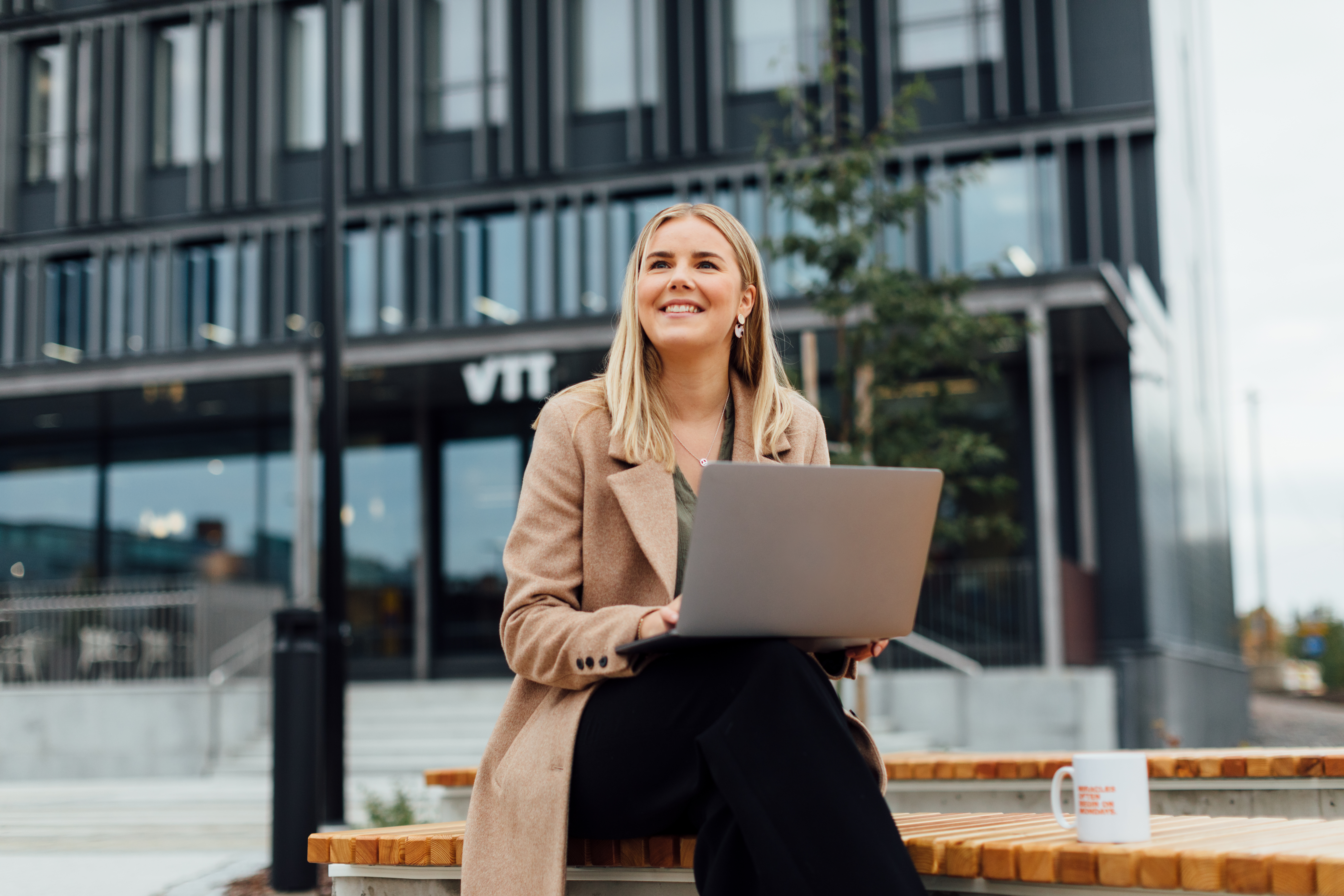 vtthappywomanworkingwhilesittingoutside