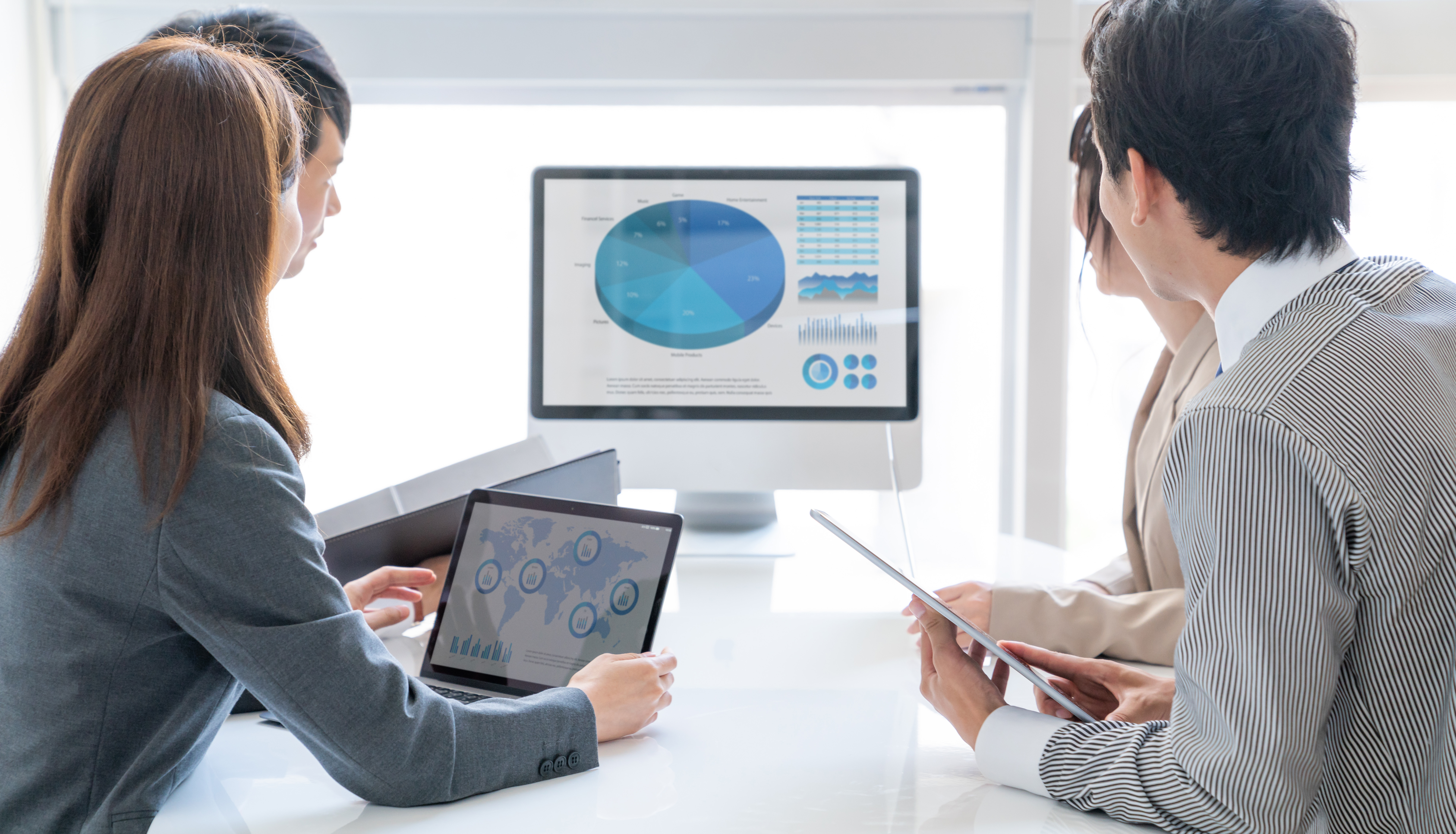 Business people looking at screen