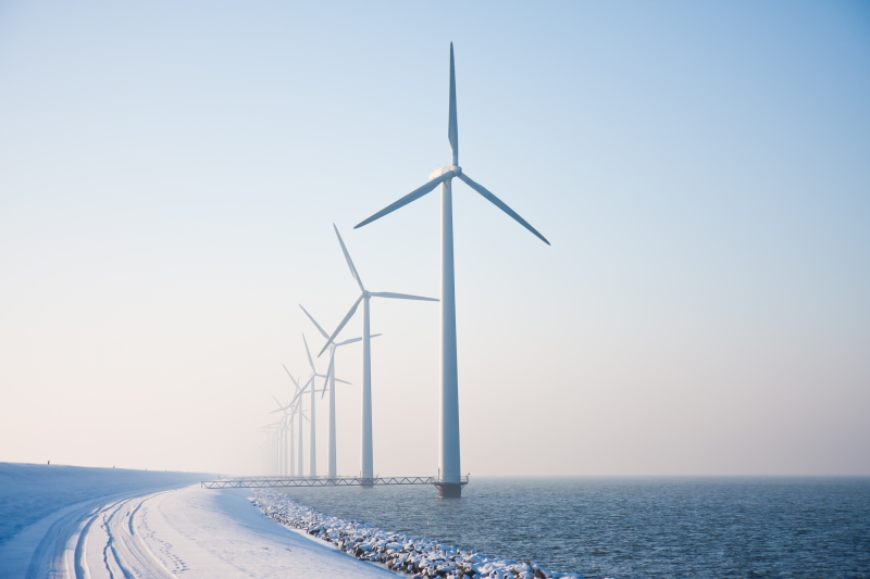 Snowywindmillsonseawintertime