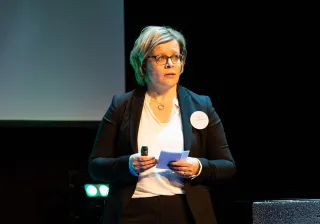 VTT&#039;s Principal Scientist Heli Helaakoski on stage speaking