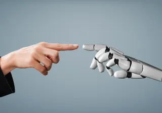 robot and human hands touching