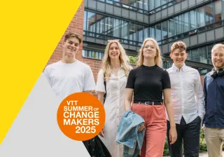 Five young people standing together outdoors, smiling confidently, with a modern office building in the background. The image promotes 'VTT Summer of Changemakers 2025,' featuring a bright yellow and orange design element.