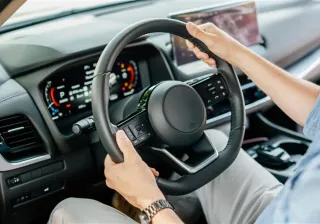 Person driving a car