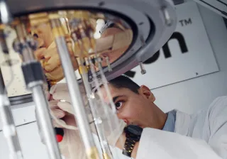 SemiQon scientist working with quantum computer cryostat