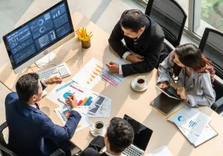 People handling charts in the office