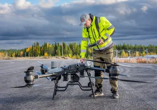 DroneanditsflyerFinnishlandscape