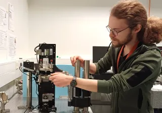 Aleksi Mattila working at VTT MIKES lab