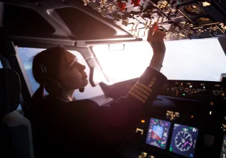 Pilot controlling a passenger plane