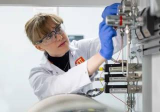 Researcher using hotlab equipment