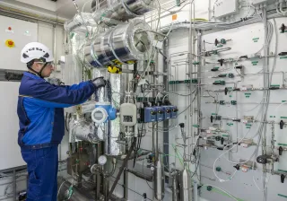 a scientist operating a mobile synthesis unit