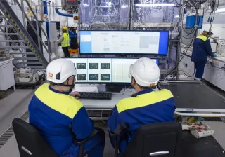 personnel monitoring a process