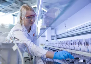 a scientist operating an Ambr 250 bioreactor