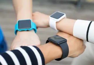 Threearmsholdingsmartwatches