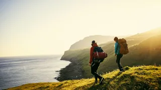 People hiking in the coastline