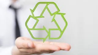Recycling image hovering over open hand