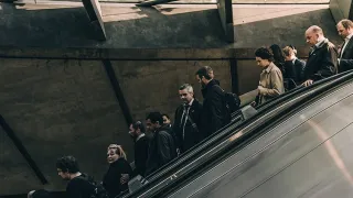 People going down on an escalator 