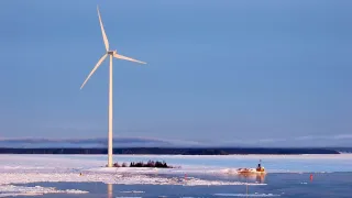 Wind turbine by icy sea