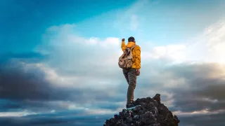 Man on top of a mountain
