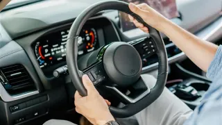 Person driving a car