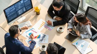 People handling charts in the office