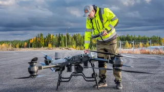 DroneanditsflyerFinnishlandscape