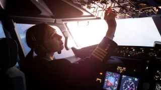 Pilot controlling a passenger plane