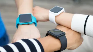 Threearmsholdingsmartwatches