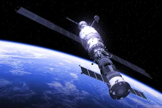 satellite in space with view of earth in background