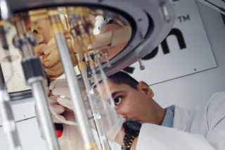 SemiQon scientist working with quantum computer cryostat