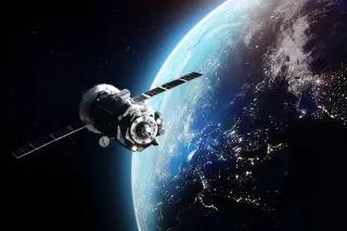 satellite orbiting earth in space