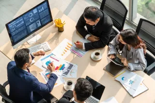 People handling charts in the office