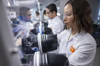 Researchers working with gloves on