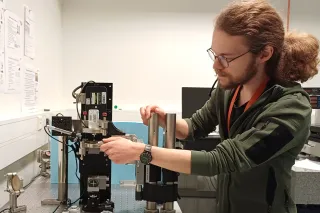 Aleksi Mattila working at VTT MIKES lab