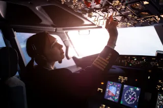 Pilot controlling a passenger plane