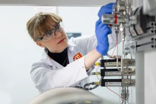 Researcher using hotlab equipment