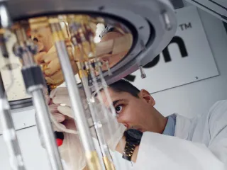 SemiQon scientist working with quantum computer cryostat