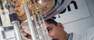 SemiQon scientist working with quantum computer cryostat