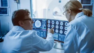 Doctors examining MRI imaging results