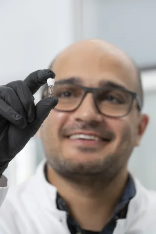 researcher holding a nanocellulose implant