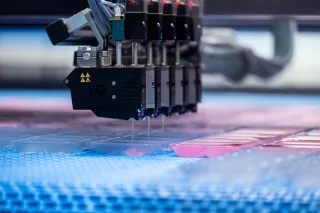 ski wax injected into containers on a production line