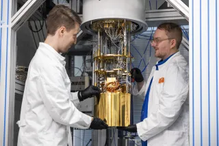 Two quantum researchers working with a quantum computer