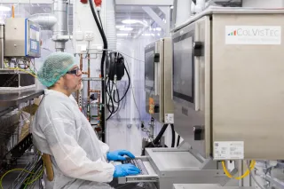 a scientist operating the VAREX mechanical plastic recycling line